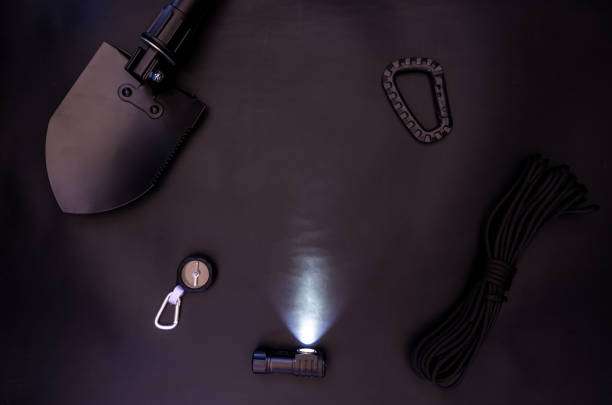 Outdoor survival gear with a lit headlamp.